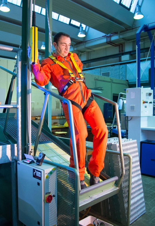 Photo: Man with fall protection on slider level